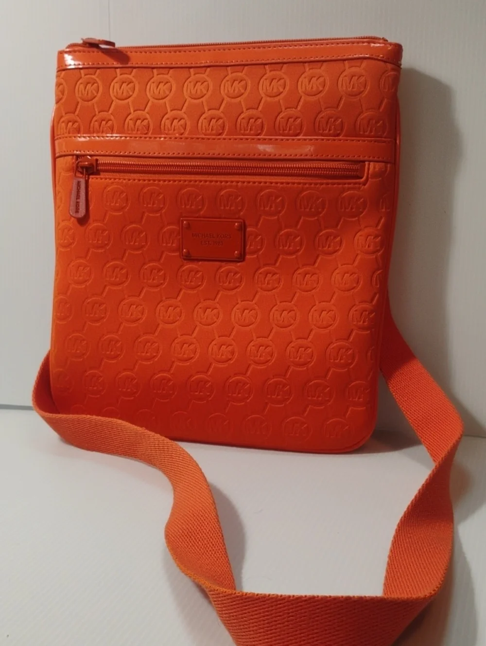Michael Kors Neoprene Tangerine Mono Embossed Swing Crossbody bag